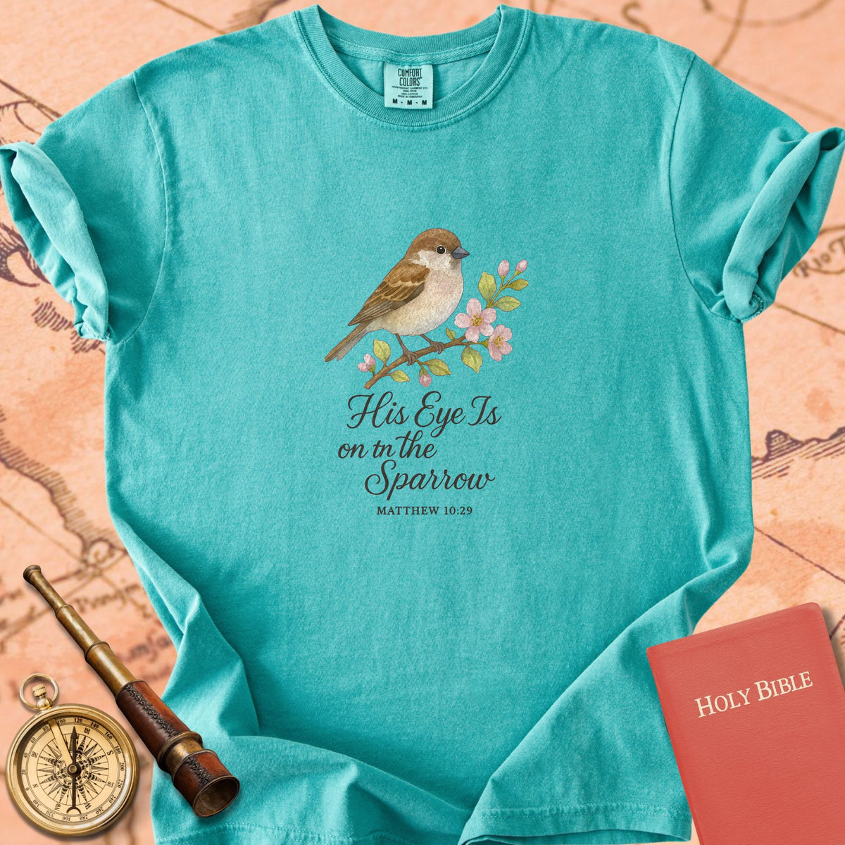 His Eye Is on the Sparrow — Sparrow Premium T-shirt — Seafoam Comfort Colors