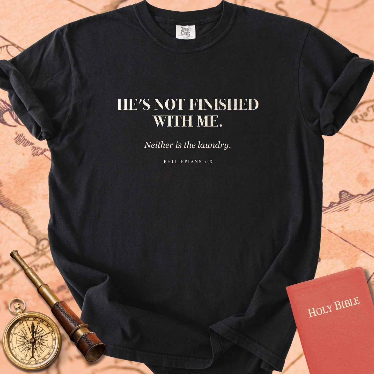 He's Not Finished With Me. — Black Comfort Colors t-shirt