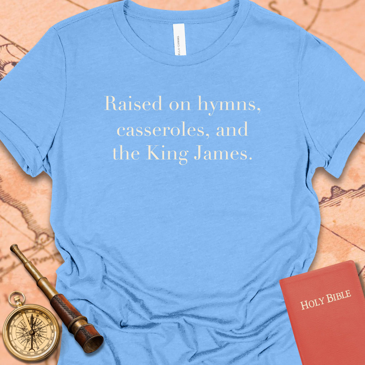 Raised on Hymns, Casseroles and the King James. Women's Tee