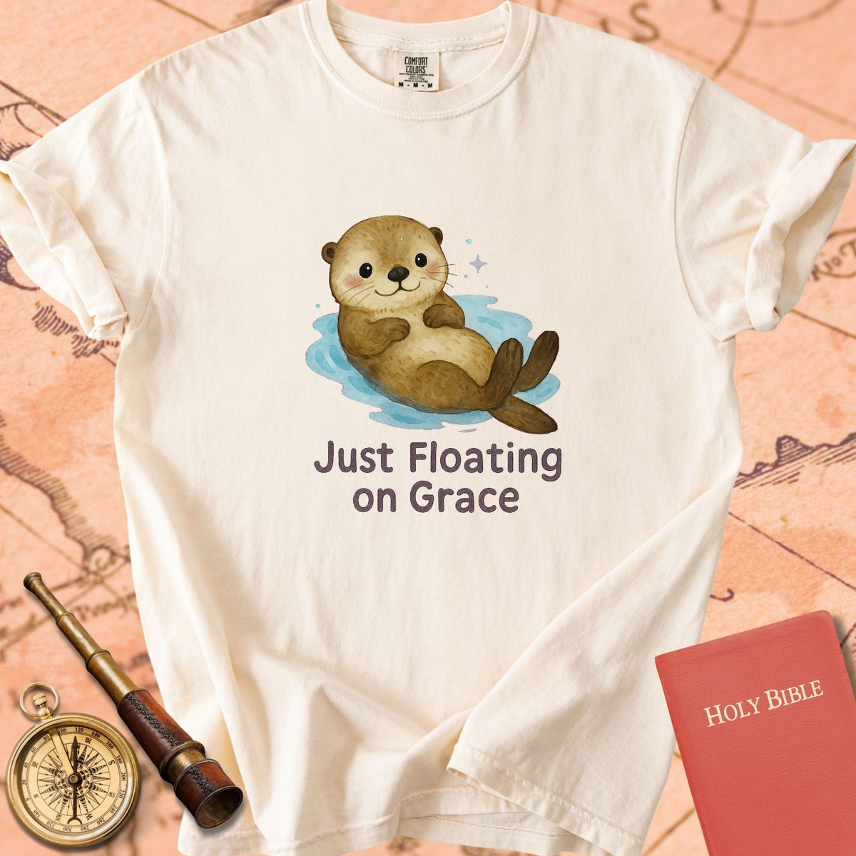 Just Floating on Grace — Cute Otter Premium T-shirt — Ivory Comfort Colors