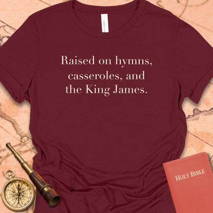 Raised on Hymns, Casseroles and the King James. Women's Tee