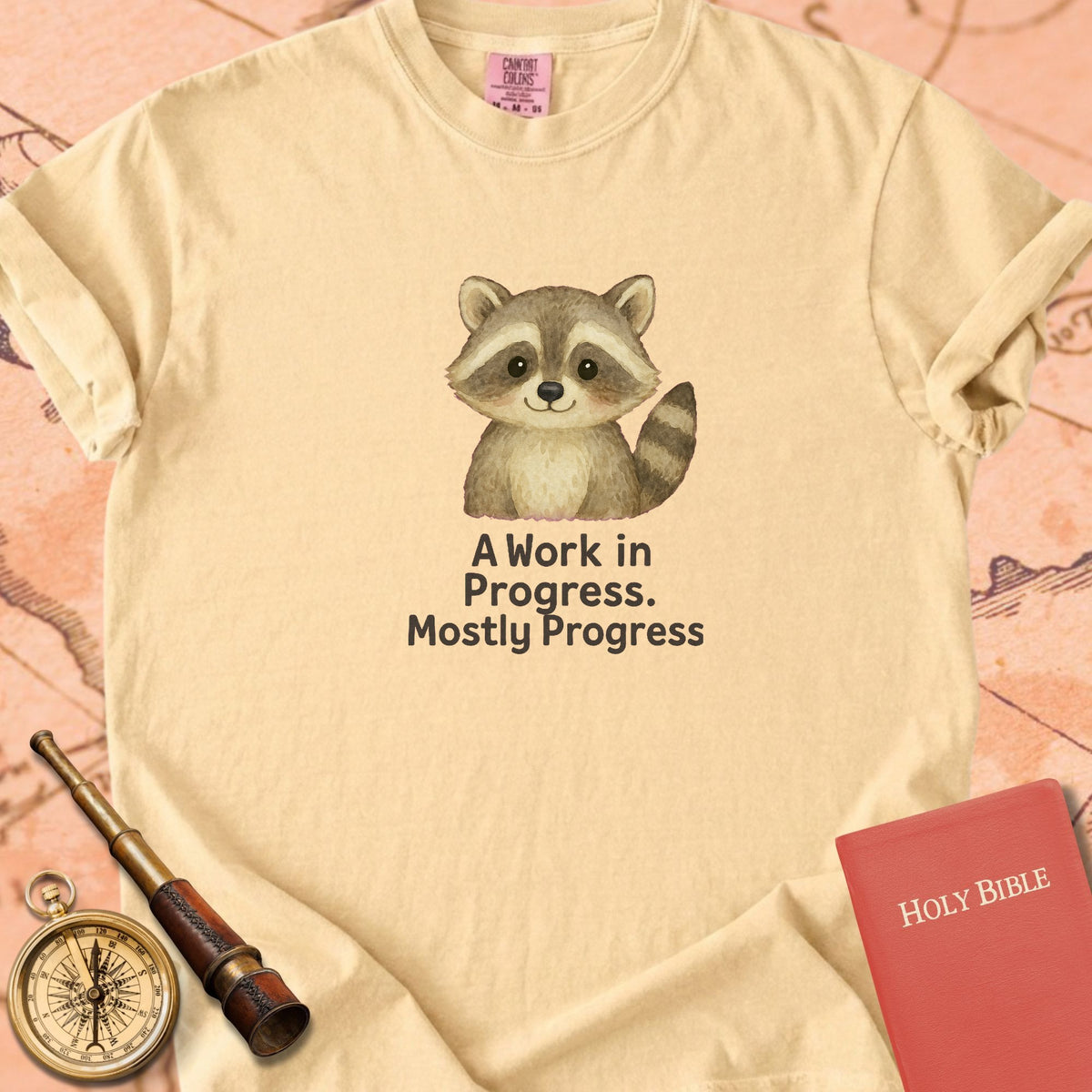 A Work in Progress, Mostly Progress — Cute Raccoon Premium T-shirt — Butter Comfort Colors