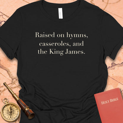 Raised on Hymns, Casseroles and the King James. Women's Tee