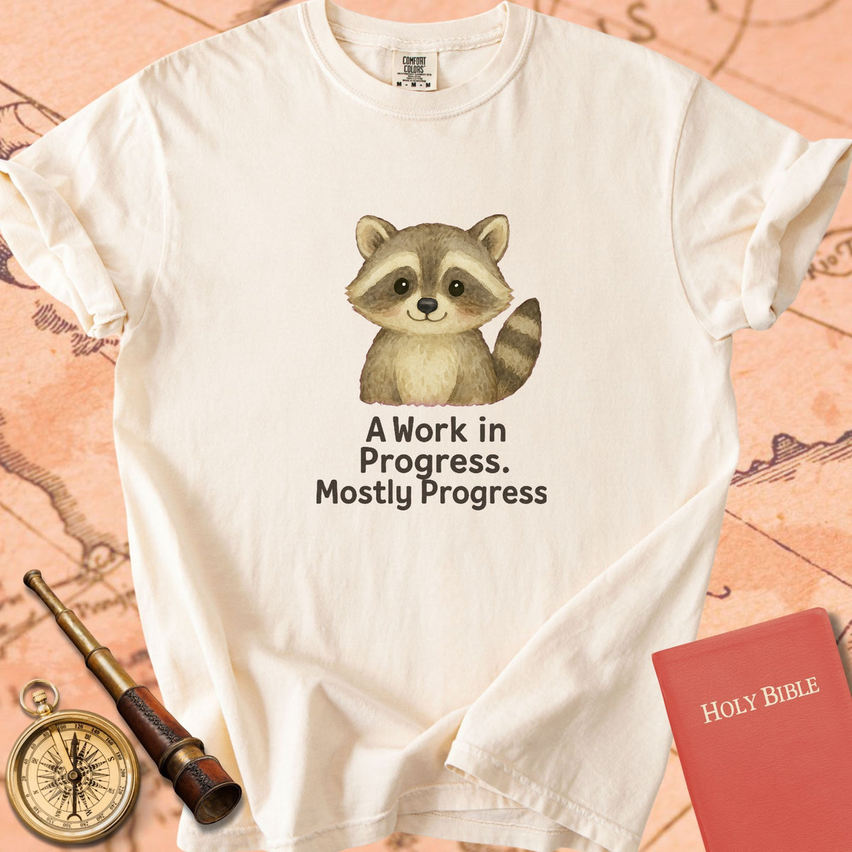 A Work in Progress, Mostly Progress — Cute Raccoon Premium T-shirt — Ivory Comfort Colors