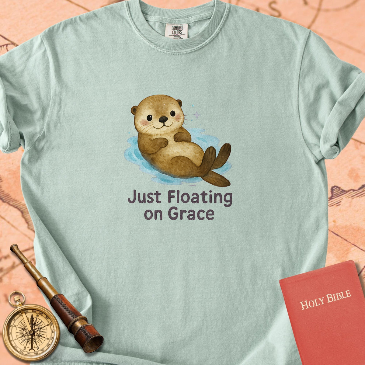 Just Floating on Grace — Cute Otter Premium T-shirt — Bay Comfort Colors