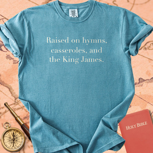 Raised on Hymns, Casseroles, and the King James. Premium T-Shirt