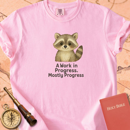 A Work in Progress, Mostly Progress — Cute Raccoon Premium T-shirt — Blossom Comfort Colors