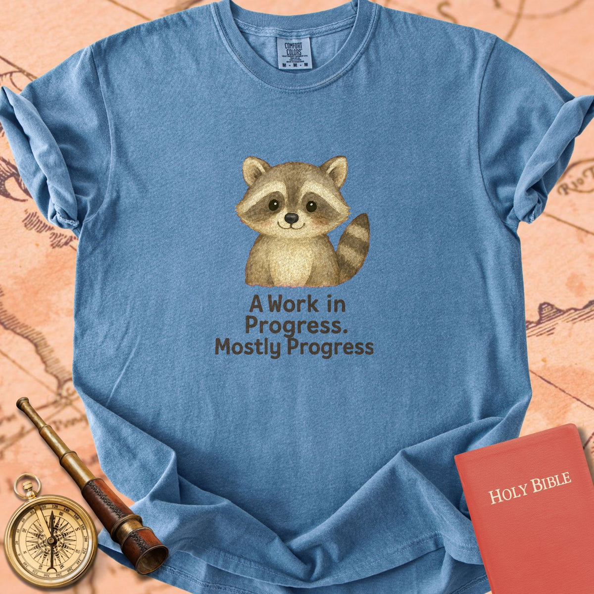 A Work in Progress, Mostly Progress — Cute Raccoon Premium T-shirt — Blue Jean Comfort Colors