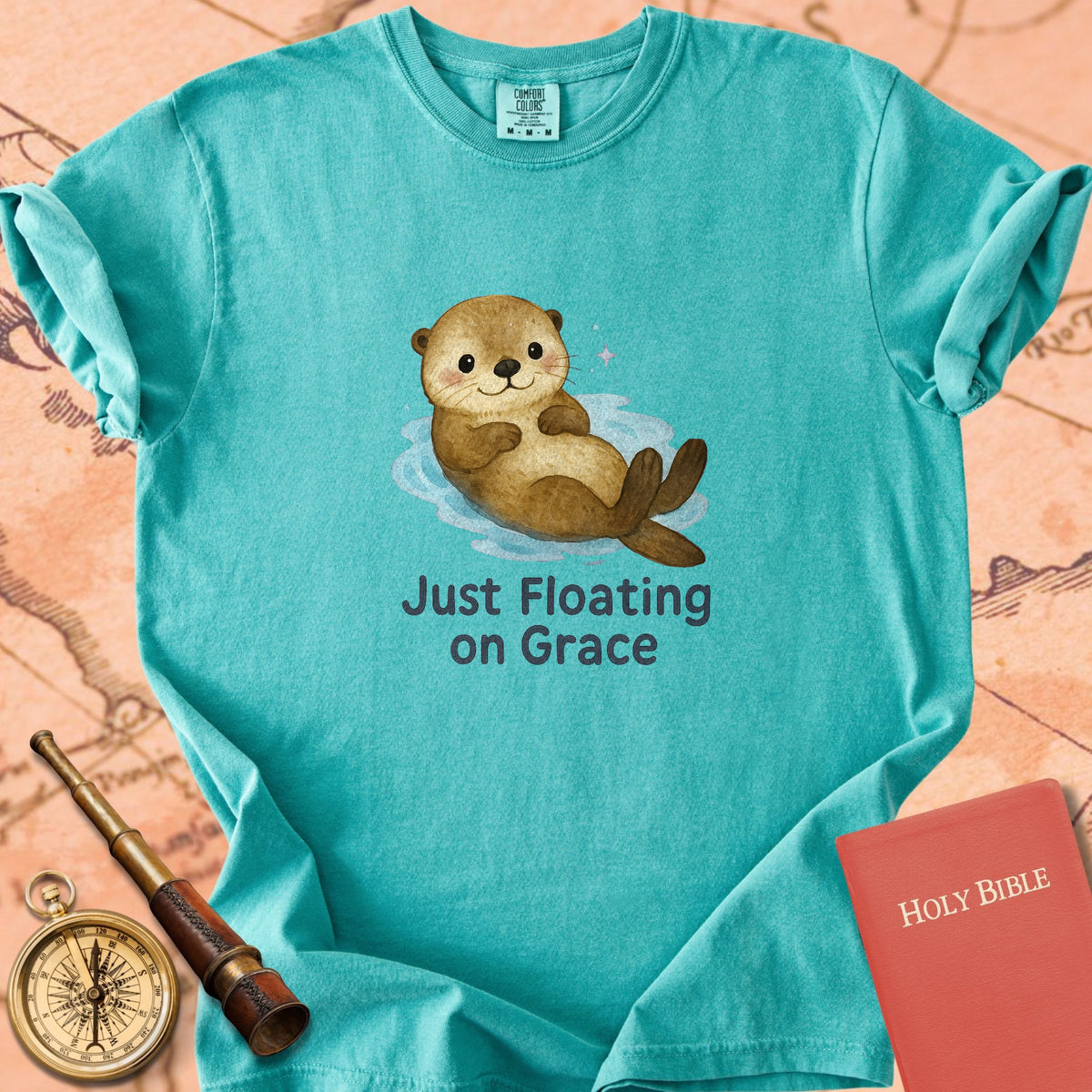 Just Floating on Grace — Cute Otter Premium T-shirt — Seafoam Comfort Colors