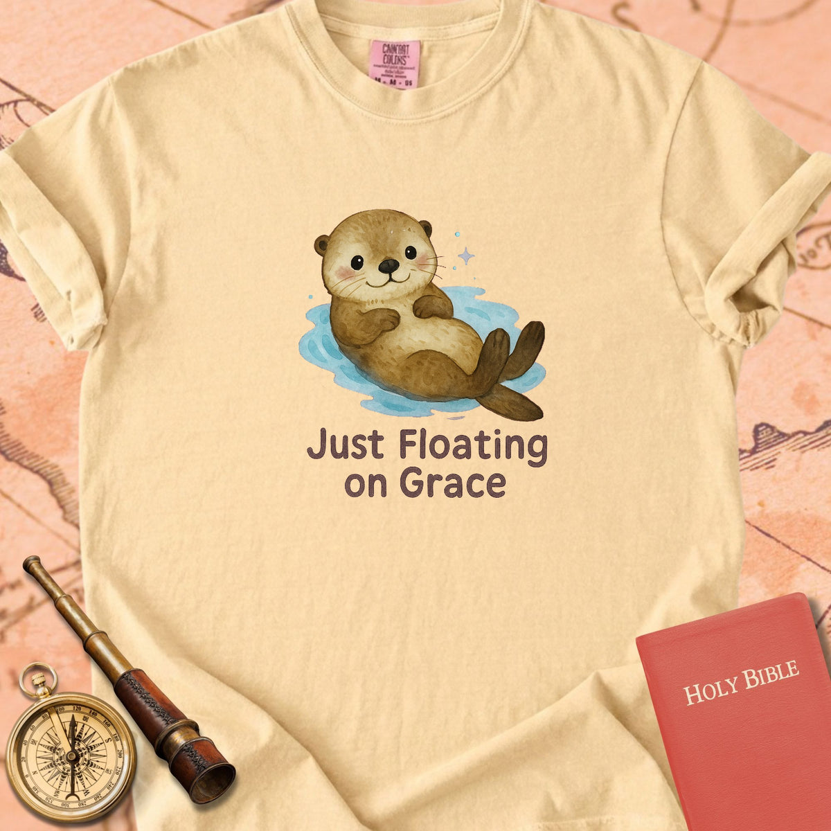 Just Floating on Grace — Cute Otter Premium T-shirt — Butter Comfort Colors